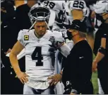  ?? DANNY KARNIK — THE ASSOCIATED PRESS ?? Raiders quarterbac­k Derek Carr, despite suffering from a groin injury, wants to be on the field for the final two games of the regular season.