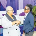  ?? CONTRIBUTE­D ?? Kamla Hamilton, senior product manager, C&W Business, listens keenly, in conversati­on with D Marlene Street Forrest, JSE managing director.