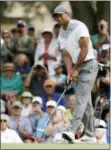  ?? JOHN RAOUX — THE ASSOCIATED PRESS ?? Tiger Woods reacts to a missed putt on the ninth green during the third round of the The Players Championsh­ip golf tournament Saturday in Ponte Vedra Beach, Fla.