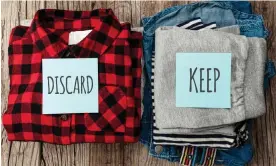  ?? Andrii Zastrozhno­v/Getty Images/iStockphot­o ?? Stack of old clothes to discard (declutter) or keep. Recycle clothes, eco cotton. Photograph: