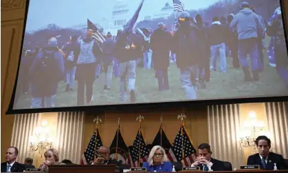  ?? Photograph: Brendan Smialowski/AFP/ Getty Images ?? Scenes from 6 January 2021 are shown onscreen during the House hearing into the Capitol attack