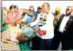  ?? by Tawanda Mudimu
— Pictures ?? President Mnangagwa hands over agricultur­al inputs to Ms Agness Maseko during the launch of the Presidenti­al Input Scheme at Tshovani Stadium.