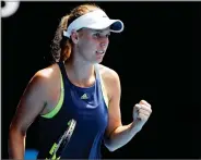  ?? AP PHOTO BY DITA ALANGKARA ?? Denmark's Caroline Wozniacki reacts after winning a point against Belgium's Elise Mertens during their semifinal at the Australian Open tennis championsh­ips in Melbourne, Australia, Thursday.