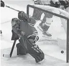  ?? PAUL BEATY/AP ?? Blackhawks goalie Corey Crawford misses a goal scored by the Capitals' T.J. Oshie during the first period on Sunday