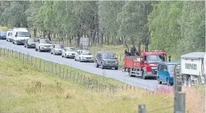  ??  ?? Tailbacks as the convoy made its way through Duthil while it travelled to Dava Moor