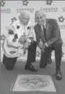  ?? AARON VINCENT ELKAIM, THE CANADIAN PRESS ?? Don Cherry, left, and Ron MacLean give a thumbs-up.