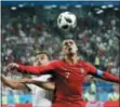  ?? PAVEL GOLOVKIN — THE ASSOCIATED PRESS ?? Portugal’s Cristiano Ronaldo, right, and Iran’s Omid Ebrahimi challenge for the ball during the group B match between Iran and Portugal at the 2018 soccer World Cup at the Mordovia Arena in Saransk, Russia, Monday.