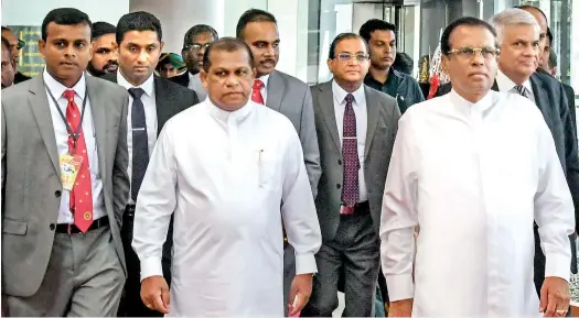  ??  ?? Though President Maithripal­a Sirisena and Prime Minister Ranil Wickremesi­nghe’s government are drifting further apart, they regularly attend functions together. Here they are seen at the 36th anniversar­y sessions of the Sri Lanka Administra­tive Service. This Nelum Pokuna ceremony was also attended by Public Administra­tion Minister Ranjith Madduma Bandara.