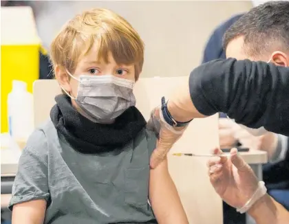  ?? Photo /AP ?? A boy receives the vaccine inside an Airbus in a German initiative to promote the jab for children.