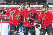  ?? WAYNE CUDDINGTON ?? Clarke MacArthur, seen skating past teammates Ryan Dzingel, left, and Kyle Turris at a practice on Wednesday in Ottawa, says the Ottawa Senators are “underdogs for sure” in their next playoff series.