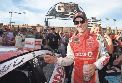  ?? MATT SULLIVAN/GETTY IMAGES ?? Matt Kenseth, driver of the #20 Circle K Toyota, celebrates after winning the Monster Energy NASCAR Cup Series Can-Am 500 at Phoenix Internatio­nal Raceway on Nov. 12 in Avondale, Ariz.