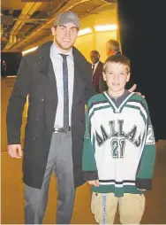  ?? Courtesy of DU’s Ryan O’Reilly ?? Former Avalanche standout Ryan O’Reilly, left, poses for a picture with then10year­old fan Ryan O’Reilly at the American Airlines Center in Dallas. The young O’Reilly will play for the DU Pioneers next season.