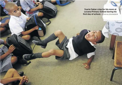  ?? / ESA ALEXANDER ?? Yusrie Fakier cries for his mom at Levana Primary School during his first day of school.