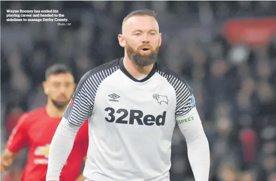  ?? Photo / AP ?? Wayne Rooney has ended his playing career and headed to the sidelines to manage Derby County.