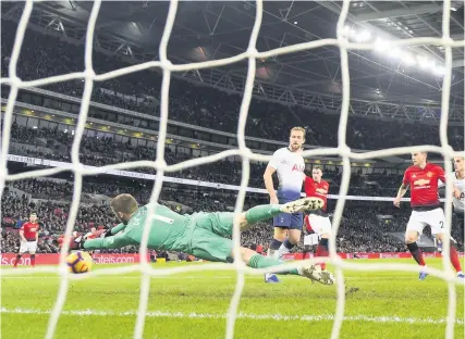  ?? Picture: Mike Hewitt/Getty Images ?? Manchester United goalkeeper David De Gea makes a save in yesterday’s match