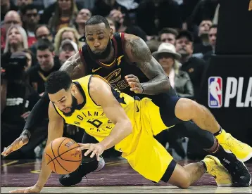  ?? GETTY IMAGESA ?? LeBron James tries to get the ball away from Canadian Cory Joseph during yesterday’s loss.