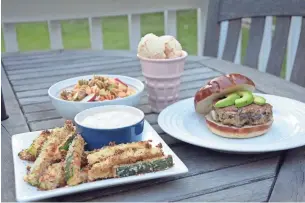  ?? BRENTON GOSPODAREK ?? Zucchini fries with ranch dipping sauce, chicken pasta salad, Portobello veggie burgers and Baileys ice cream are a festive way to celebrate summer.