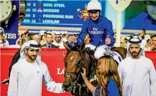  ?? — KT photo ?? Sheikh Hamdan celebrates Benbatl’s win in Dubai World Cup at Meydan in March.