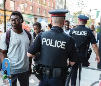  ?? PHOTOS: ERROL MCGIHON ?? Ottawa Police patrol the Glowfair Festival in June. Organizers say the cost of paid-duty officers on top of private security is onerous, and are calling on the city to review event requiremen­ts.