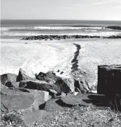  ?? Associated Press ?? ■ This Feb. 5 photo shows boulders leading down to the beach in Deal, N.J. on a street end that the town plans to give up to a private property owner. Beach access advocates fear a popular spot for surfers, fishermen and others to get onto the sand will be blocked off, but the town insists that won't be the case.