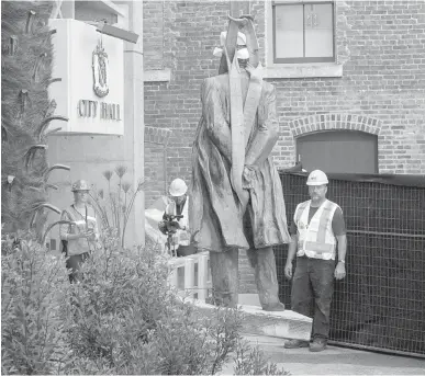  ?? TC FILE ?? Crews remove the statue of John A. Macdonald in front of Victoria City Hall on Aug. 11. If the statue’s removal lets Indigenous people know they have been heard, the process was worthwhile, Charla Huber writes.