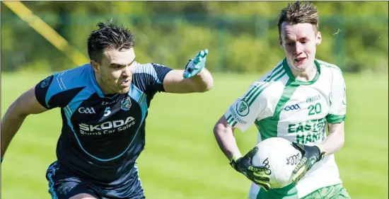  ??  ?? Neal Hayes of St John’s in action with Eastern Harps’s Shawn O’Hara during the Belfry Senior Football Championsh­ip Relegation Play-Off in Connolly Park on Sunday. Pic: Tom Callanan.