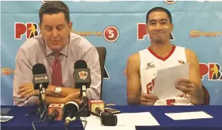  ??  ?? GINEBRA COACH Tim Cone and team captain LA Tenorio cherish the moment of beating San Miguel Beer.