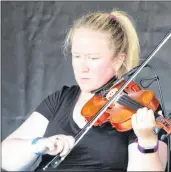  ?? KATHERINE HUNT/THE GUARDIAN ?? Dara Smith-MacDonald, of Cape Breton, showed her talent on Saturday during the 2018 Rollo Bay Fiddle Festival.