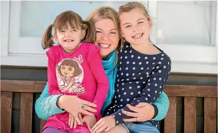  ??  ?? The Tate girls Zoe, left, and Tess with mum Rosa. They are organising New Zealand’s first conference for people with wolf-hirschhorn syndrome and their families.