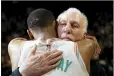  ?? AP photo ?? Gregg Popovich is hugged by guard Dejounte Murray on Friday.