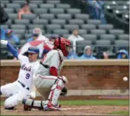  ?? MARK LENNIHAN — ASSOCIATED PRESS ?? Mets’ Brandon Nimmo slides safely into home as Phillies catcher Jorge Alfaro waits for the throw in the seventh inning of Sunday’s game at Citi Field in New York.