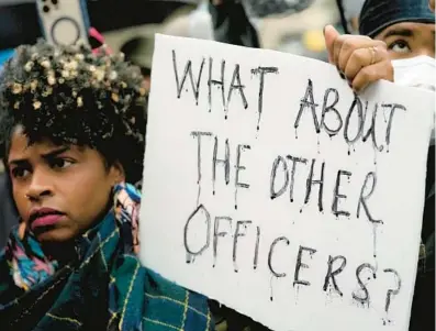  ?? GERALD HERBERT/AP ?? Protesters march Saturday in Memphis, Tenn., over the death of Tyre Nichols in police custody Jan. 7.