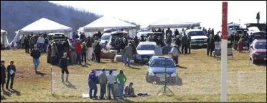  ?? Photo by Lauren R. Giannini ?? THE VIEW from the paddock early in the day as spectators set up their tailgate parties on the hill.