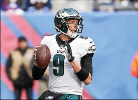  ?? JOHN BLAINE — FOR THE TRENTONIAN ?? Eagles quarterbac­k Nick Foles (9) threw four touchdown passes against the Giants during Sunday’s win over the Giants on Sunday afternoon.