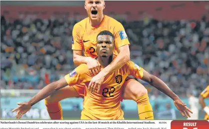  ?? REUTERS ?? Netherland­s's Denzel Dumfries celebrates after scoring against USA in the last-16 match at the Khalifa Internatio­nal Stadium.