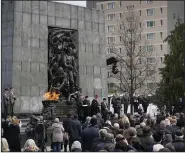  ?? (AP/Czarek Sokolowski) ?? People attend an uprising commemorat­ion Wednesday in Warsaw,
Poland.