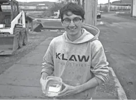  ?? RICCARDO MONICO / BINGHAMTON PRESS & SUN-BULLETIN ?? Jacob Kumpon with the finished product KLAW creates to replace some of the cement in concrete production.