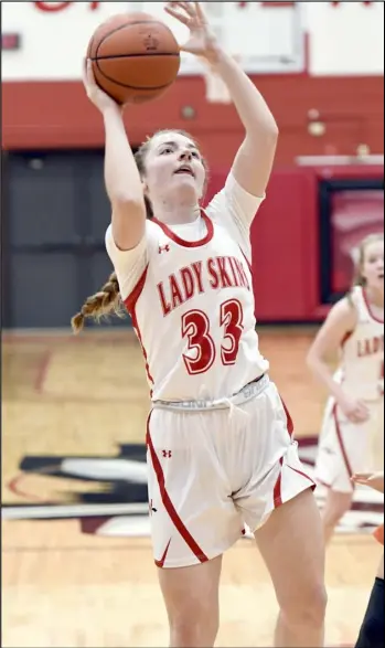  ?? Photo by John Zwez ?? Wapakoneta’s Reagan Courter attempts a shot against Minster during a nonconfere­nce game Friday night at Wapakoneta High School.