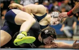  ?? NATE HECKENBERG­ER — FOR DIGITAL FIRST MEDIA ?? Malvern Prep’s Michael Beard works to turn Bethlehem Catholic’s Robert Sprezza during a 9-1 major decision in the 195-pound finals.