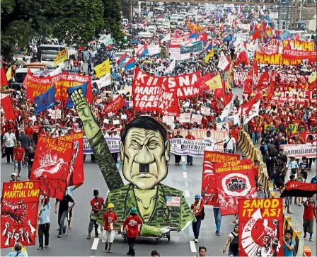  ?? — Reuters ?? A loud no: Protesters displaying an effigy of Duterte during a march towards the Philippine Congress ahead of the president’s State of the Nation address in Quezon city, Manila.