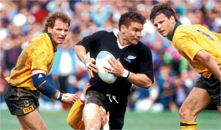  ??  ?? Michael Jones, who famously refused to play on Sundays, makes a break against the Wallabies in 1991.