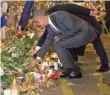  ?? EVAN VUCCI, AP ?? President Obama places a single rose at the Bataclan concert hall, site of the worst of the Paris attacks.