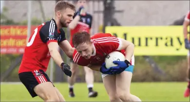  ??  ?? Kevin Banks of Coolera/Strandhill in action with Drumcliffe/Rosses Point’s Jamie Gillen. Pic: Donal Hackett.