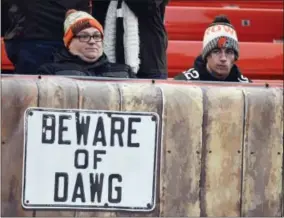  ?? DAVID RICHARD — THE ASSOCIATED PRESS FILE ?? In this Sunday file photo, Cleveland Browns fans react during the second half of 2710 loss to the Baltimore Ravens in an NFL football game in Cleveland. Baltimore won. Despite temperatur­es forecast in the single digits, hundreds, and perhaps thousands,...