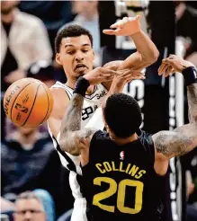  ?? Rick Bowmer/associated Press ?? Spurs center Victor Wembanyama, left, racked up five blocks in Wednesday’s win over the Utah Jazz.