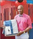  ?? PHOTO PROVIDED ?? Kevin Pryor shows a blanket donated for a recent fatherdaug­hter dance held at the Troy Boys and Girls Club.