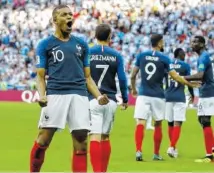  ?? THE ASSOCIATED PRESS ?? France’s Kylian Mbappe celebrates after scoring against Argentina for the second time during their match Saturday at the World Cup in Kazan, Russia. France won 4-3 and will face Uruguay in the quarterfin­als.