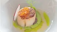  ?? ?? SEARED scallop in pea puree with trout roe at 9th Avenue Waterside.