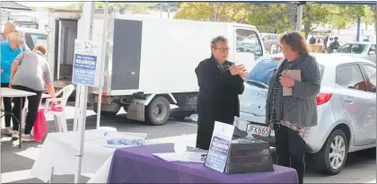  ??  ?? Committee member Shirley Williams (left) and teacher Barbara Hall at Saturday’s market, drumming up interest in the Kaitaia Intermedia­te School reunion.