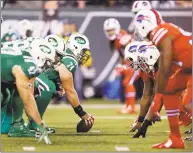  ?? Seth Wenig / Associated Press ?? The Jets offense lines up against the Bills defense during a November 2015 game. Teams are allowed two optional uniforms with choices of an alternate color, a throwback or the Color Rush featuring one color.